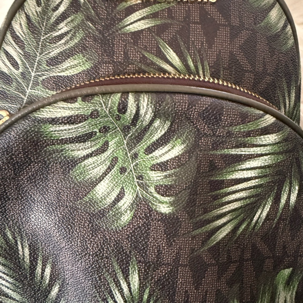 Michael Kors woman’s Backpack with Green Leaf Design.
Used good condition - Picture 2 of 5